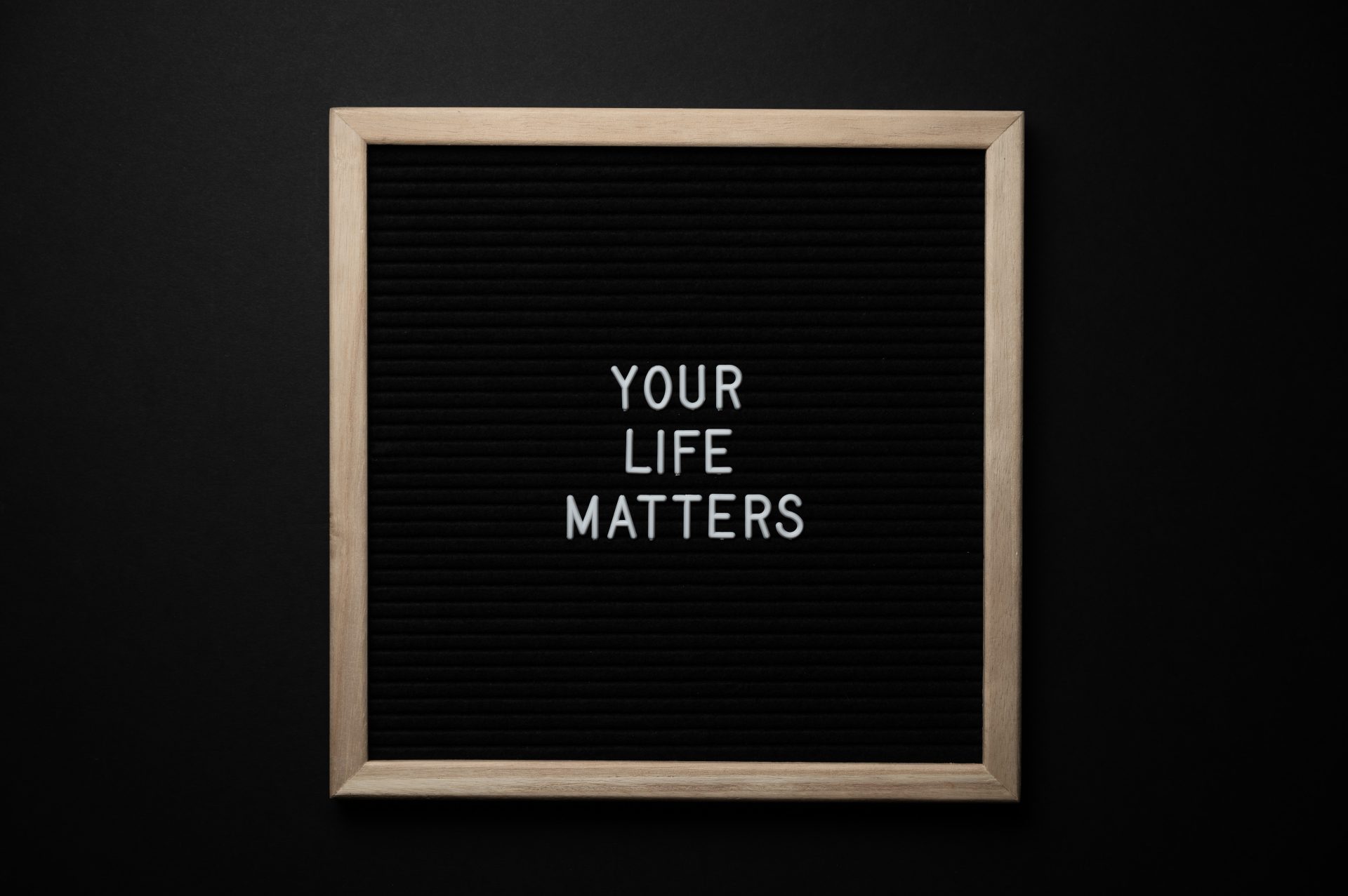Black sign board with white text that says, "YOUR LIFE MATTERS"